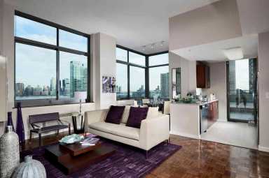 High-rise on Jersey City waterfront features outdoor pool with city views