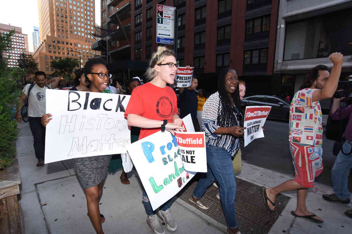 Demonstrators rally to oppose demolition of historic Downtown abolition house
