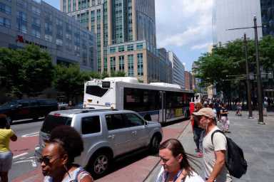Father and child injured after crashing into wheelchair ramp on busy Downtown street