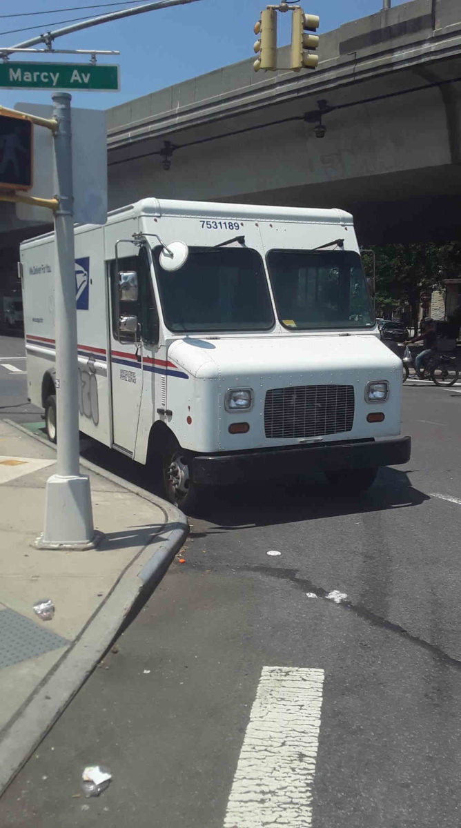 Locals blast city for failing to remove postal trucks from Williamsburg bike lane