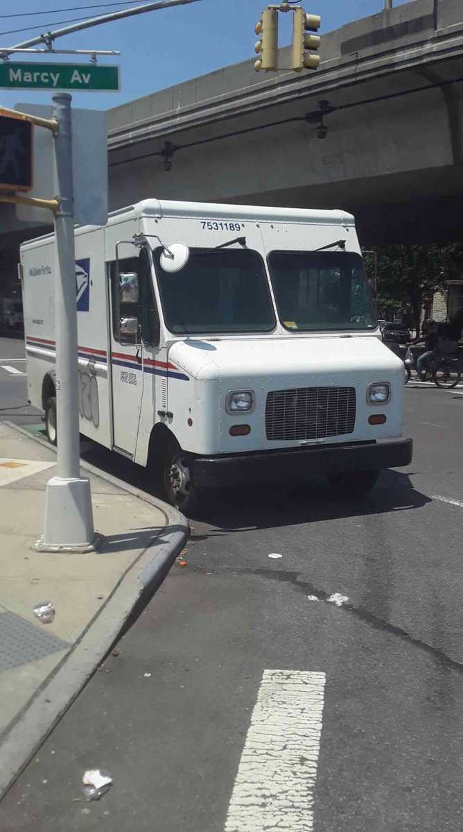 Locals blast city for failing to remove postal trucks from Williamsburg bike lane