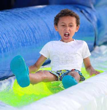 Slip and Slide: Massive UV-lit waterslide comes to Floyd Bennett Field