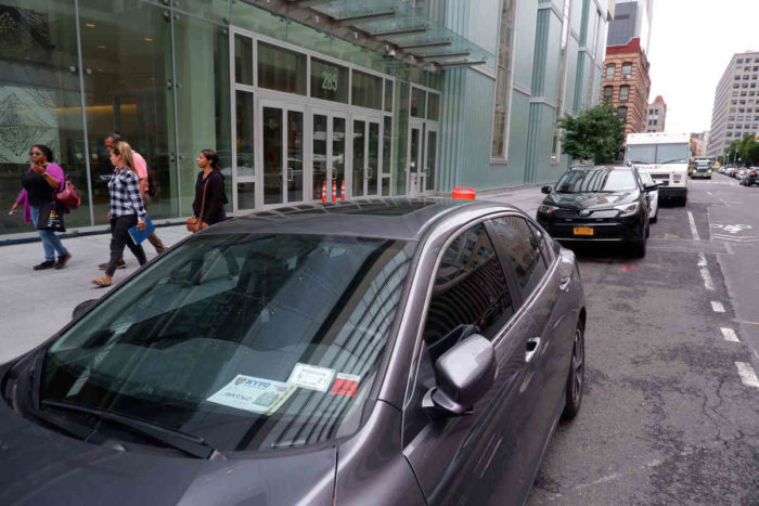 placard abuse illegally parked car on street