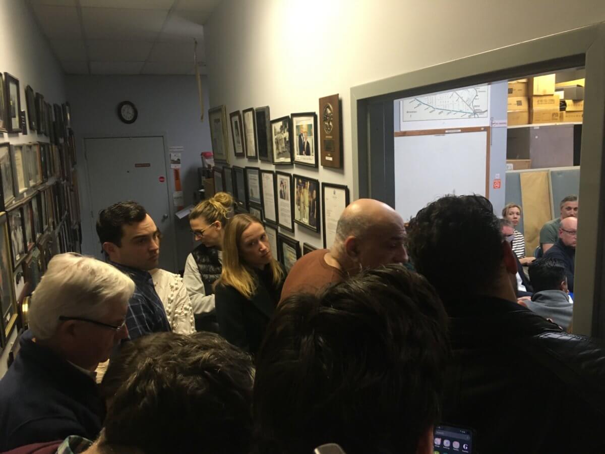 Picture of people cramped in a community board office