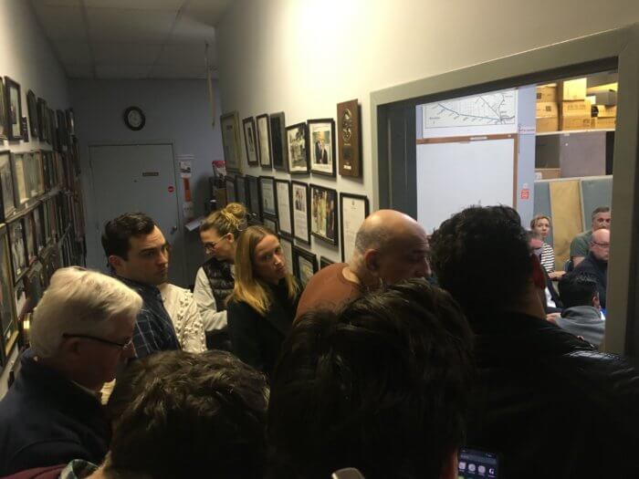 Picture of people cramped at an in-person community board office