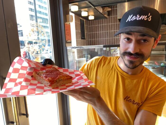 Pizza slinger Rosario Viggiano shows off a Sicilian slice.