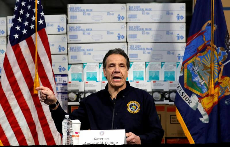 FILE PHOTO: New York Governor Andrew Cuomo speaks in front of stacks of medical protective supplies at a news conference at the Jacob K. Javits Convention Center which will be partially converted into a temporary hospital during the outbreak of the coronav