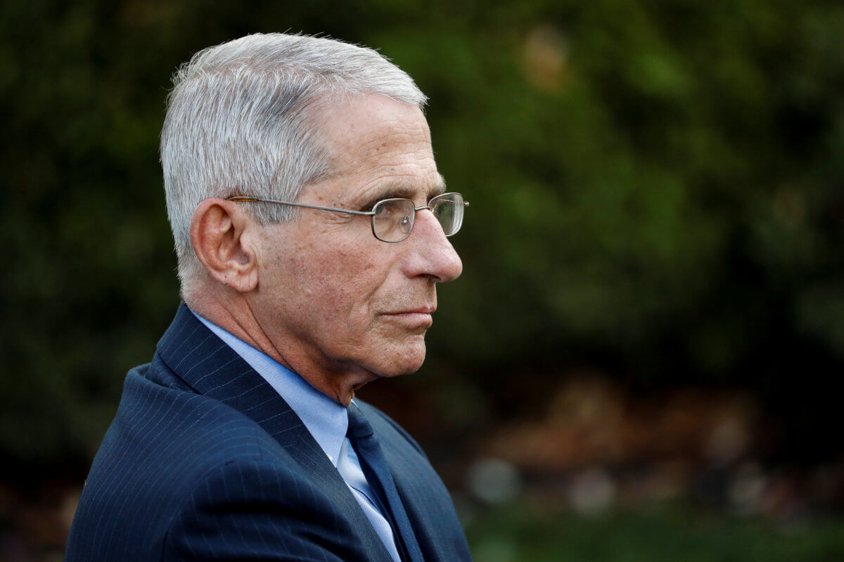 NIH National Institute of Allergy and Infectious Diseases Director Fauci listens during a news conference in the Rose Garden of the White House