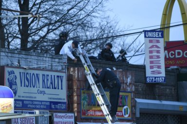 Police at the scene of a robbery at 4924 Avenue H. A suspect was