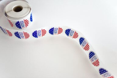 i-voted-sticker-spool-on-white-surface-1550336