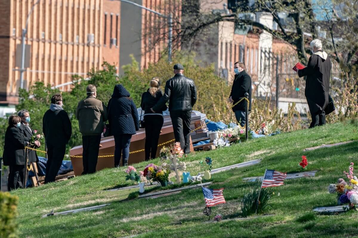 Mourners attend a funeral at The Green-Wood Cemetery during the outbreak of the coronavirus disease (COVID-19) in the Brooklyn borough of New York City