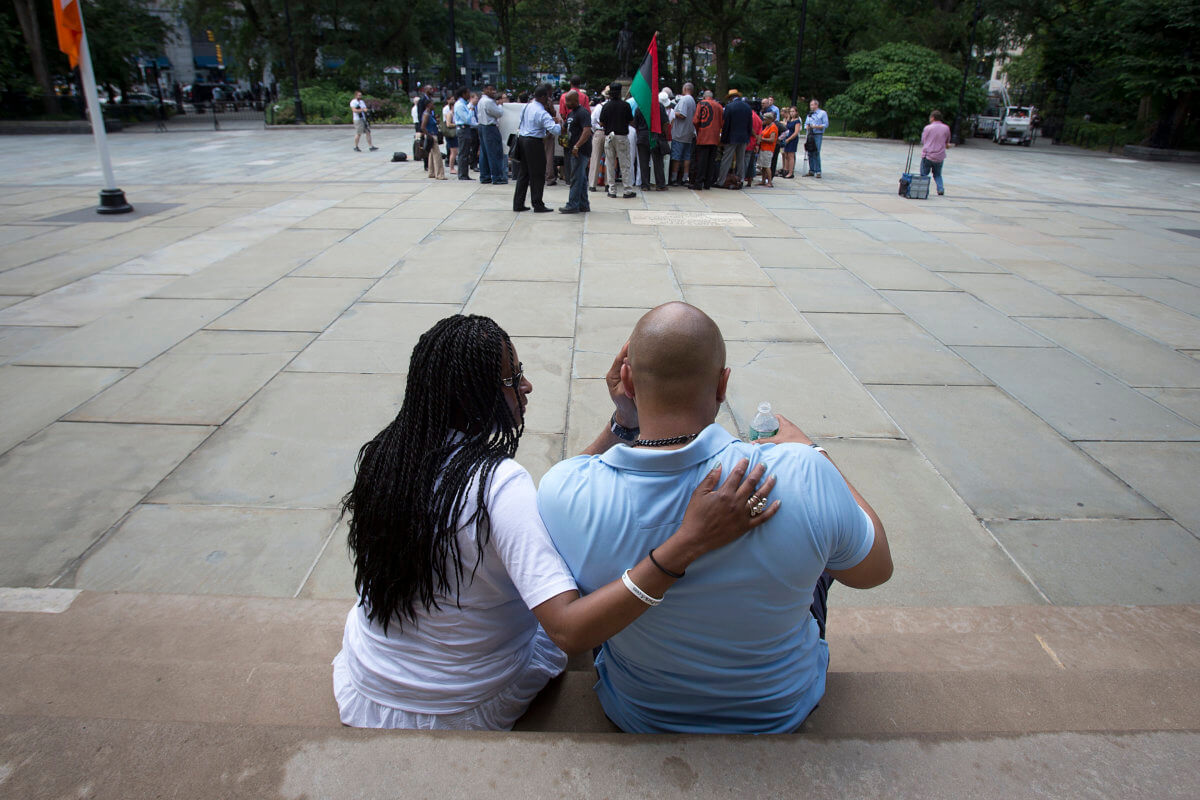 Richardson, one of the wrongly convicted “Central Park Five”, takes a break with his sister during a news conference to announce the payout for the case at City Hall in New York