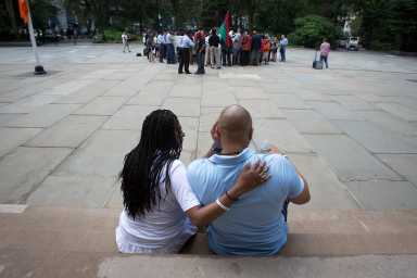 Richardson, one of the wrongly convicted “Central Park Five”, takes a break with his sister during a news conference to announce the payout for the case at City Hall in New York