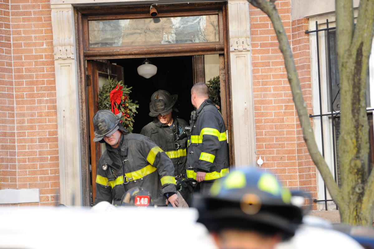 Firefighters leave scene of collaspe at 42 Street and 4 Avenue in Sunset Park.