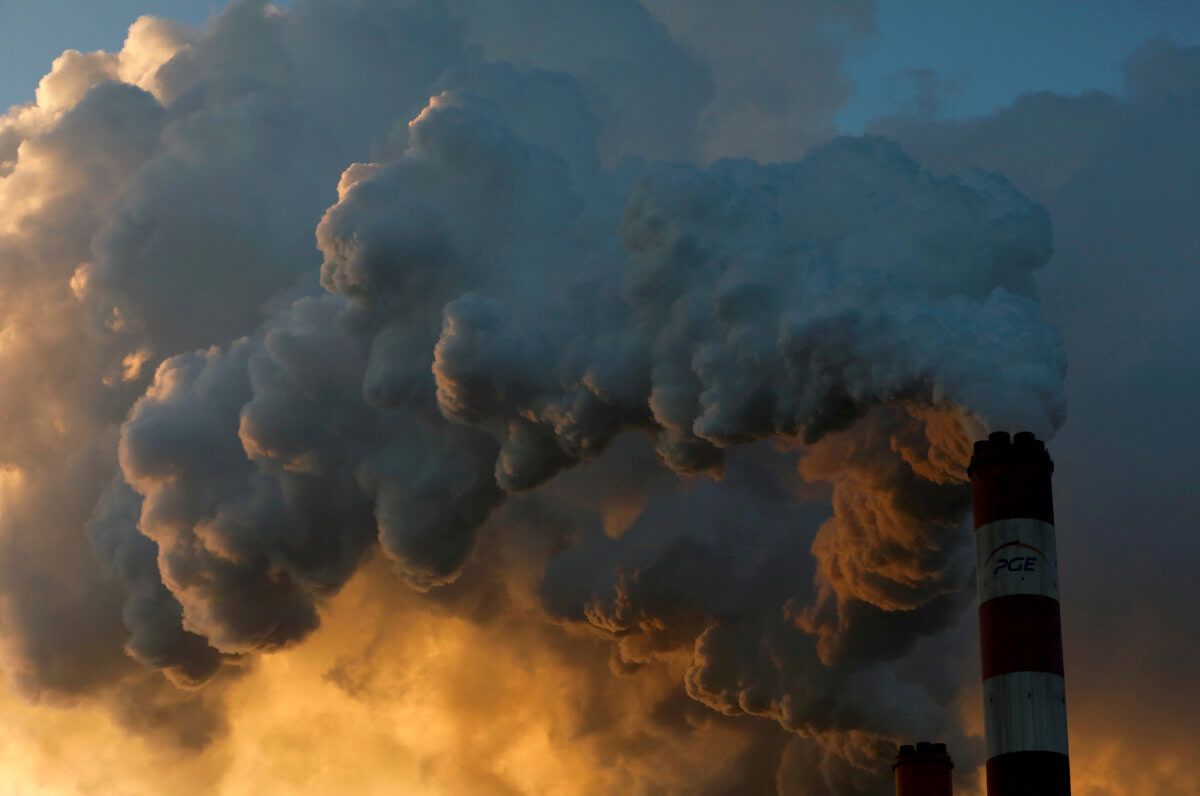 FILE PHOTO: Smoke and steam billows from Belchatow Power Station, Europe’s largest coal-fired power plant operated by PGE Group, near Belchatow