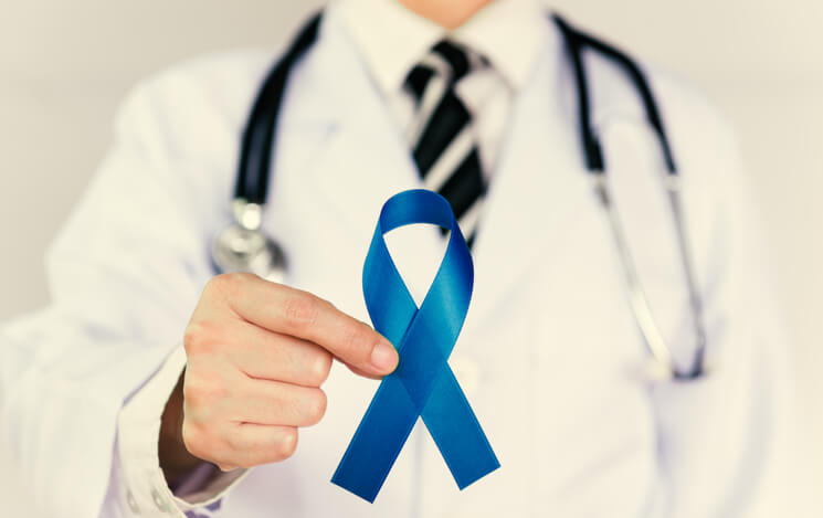 Doctor Holds Blue Ribbon