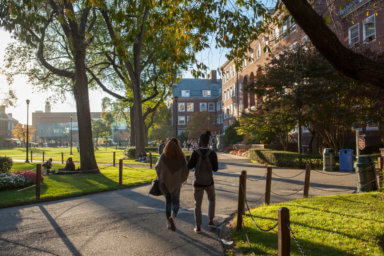 Students walking on the Brooklyn College campus in the fall.