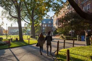Students walking on the Brooklyn College campus in the fall.