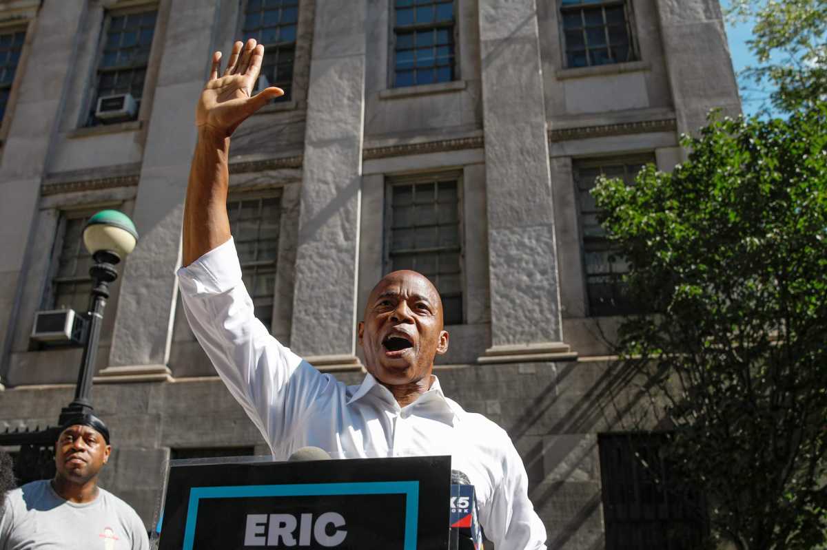 eric adams speaks to a crowd