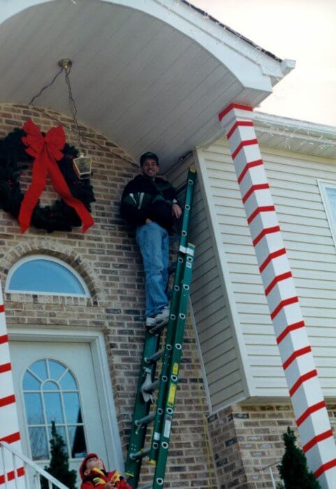 Picture of Anthony Perez decorating for Christmas