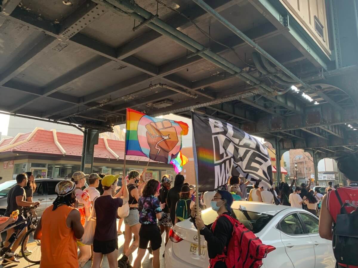 People march down Broadway protesting anti-gay attacks