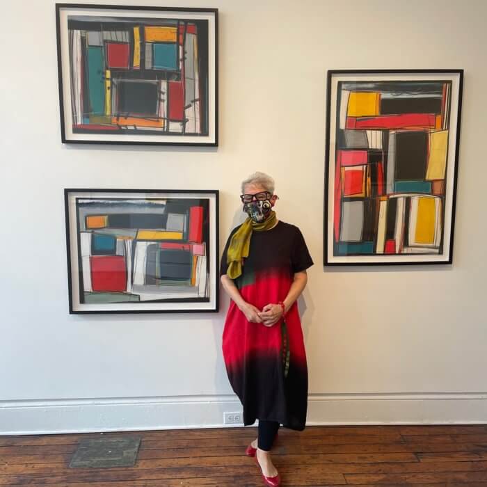 Jo-Ann Acey with some of her paintings
