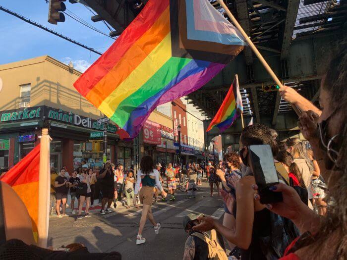 Protestors stop to dance at a rally against anti-gay hate