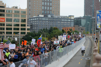 Protestors walk the Brooklyn Bridge.