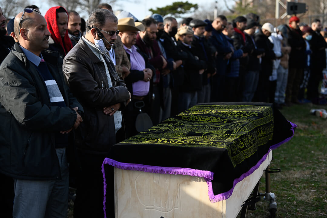 The casket of Fadhi Moosa is prayed over at Bensonhurst Park.
