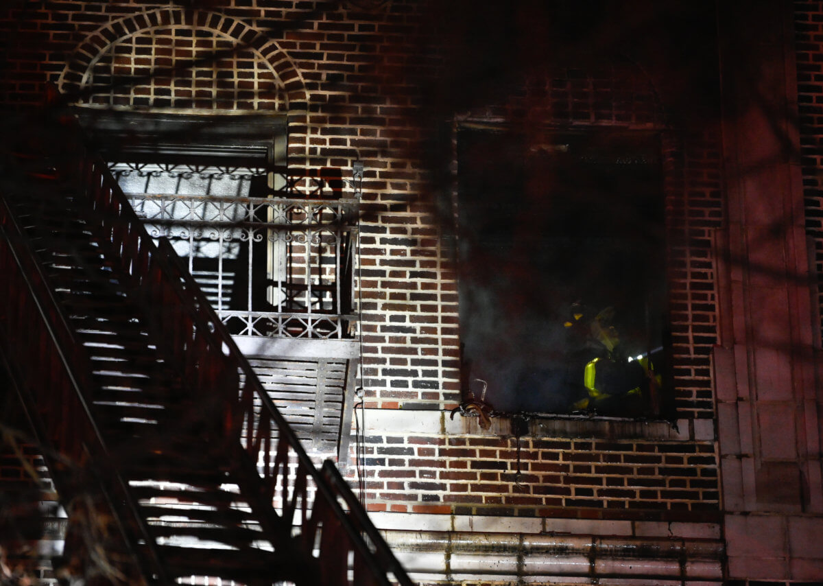 A firefighter operates in the fire apartment.