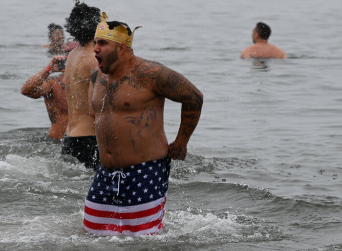 men standing in the atlantic at the polar bear plunge