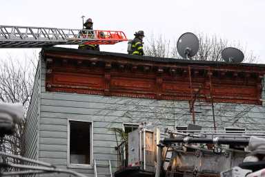 Firefighters at the scene of an all hands fire at 632 Halsey Street.