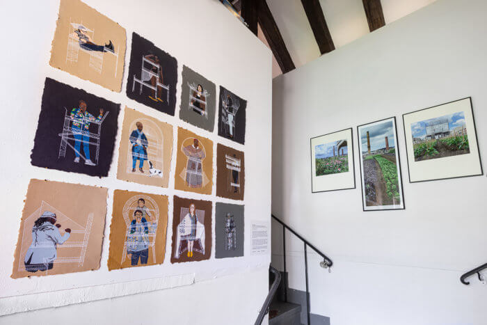 posters on a wall at the old stone house for brooklyn utopias 2020