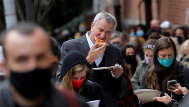 New York City Mayor Bill de Blasio stands in line to cast ballot during early voting in Brooklyn New York