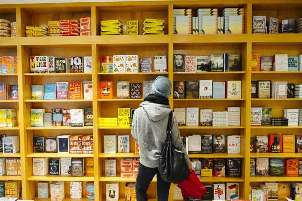 person browsing bookstore shelves puzzle