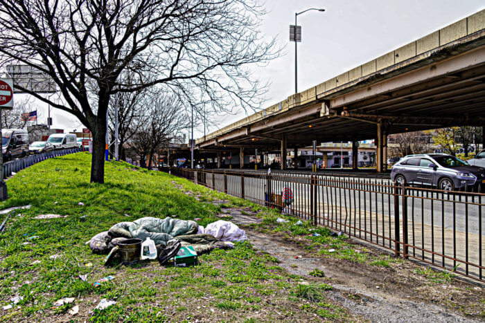 person sleeping near site of former bqe homeless encampment