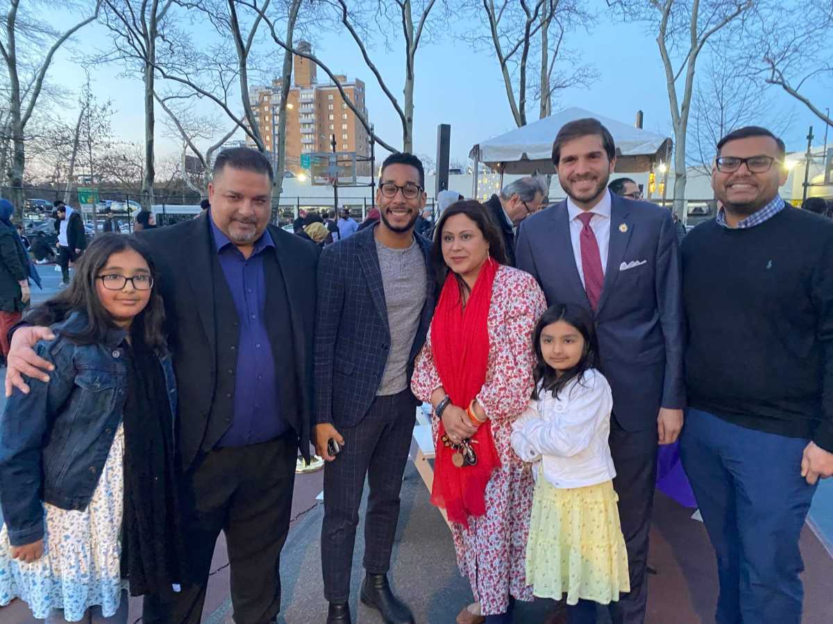 a group of people, including antonio reynoso and andrew gournades, at an iftar celebration.