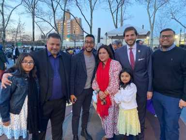 a group of people, including antonio reynoso and andrew gournades, at an iftar celebration.