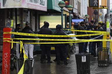 cops stand with caution tape at sunset park station after shooting