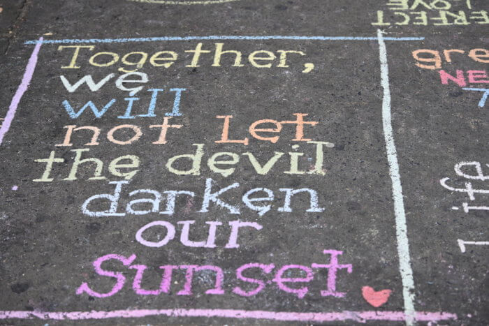 chalk message on the sidewalk in sunset park