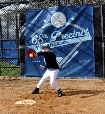 little league player at home plate as youth sports return to brooklyn