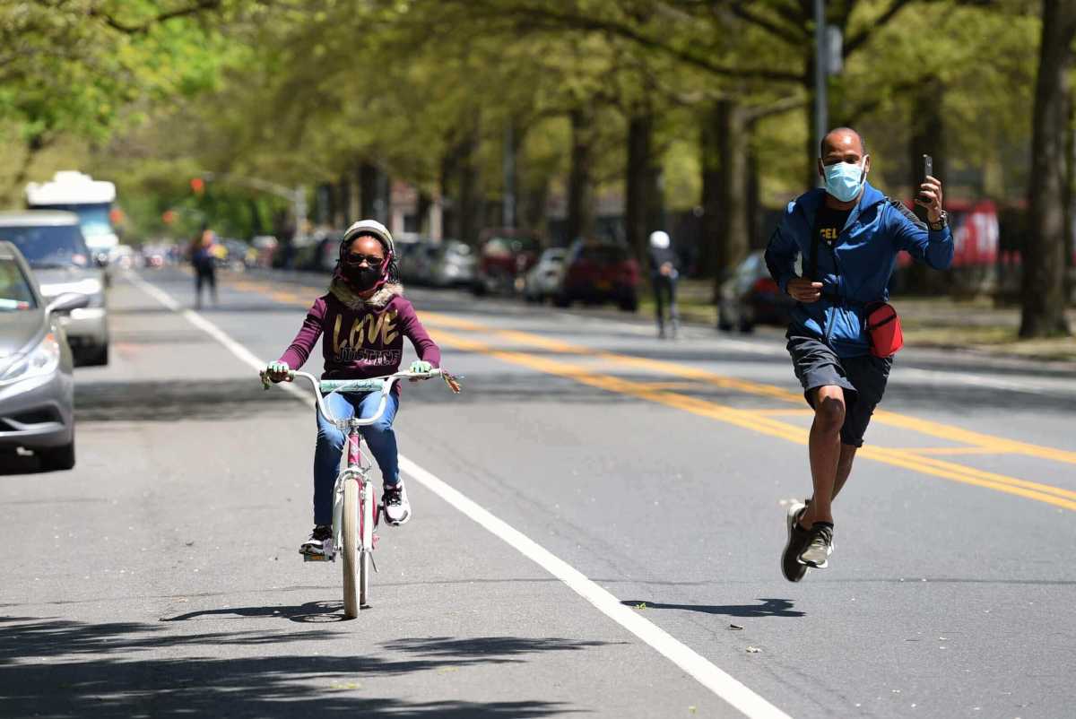 father and daughter on open street