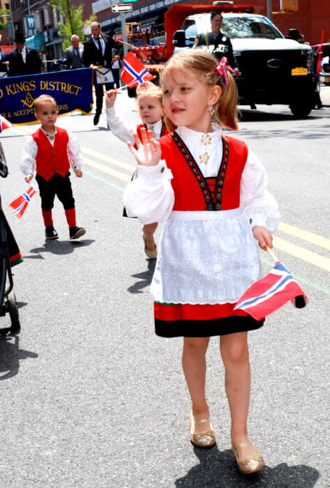 girl marching in Norwegian Day parade