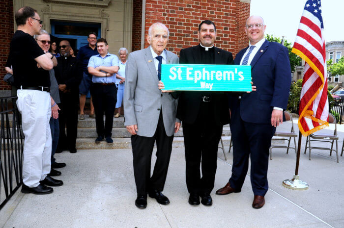 justin brannan. andrew sichenze and father robert adamo with st. ephrem's street sign