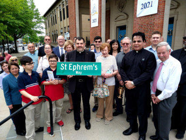 people with st ephram's street sign after conaming