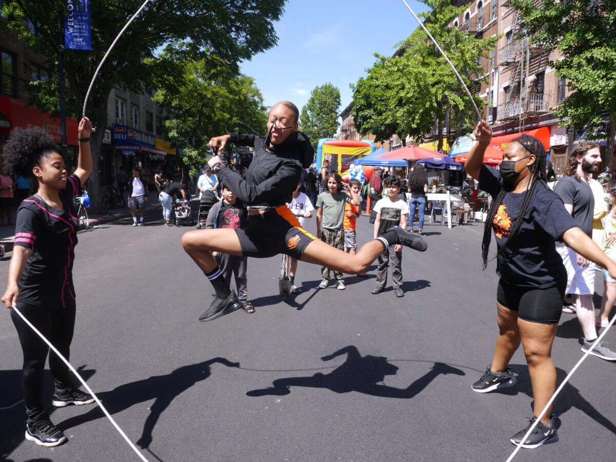people jump rope in the street at fun on 5th avenue in bay ridge