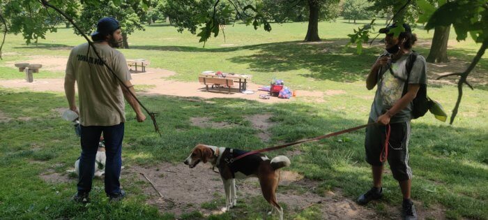 winner café owner greets a man and a dog in prospect park