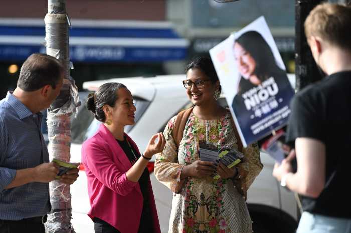 candidates outside polling place on primary election day