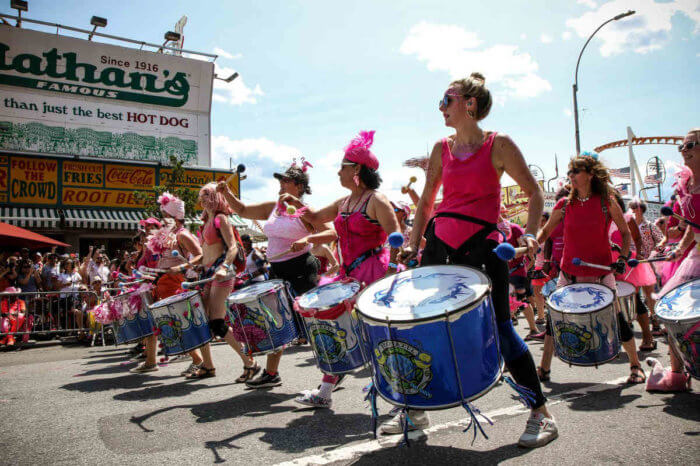 people marching in coney island mermaid parade