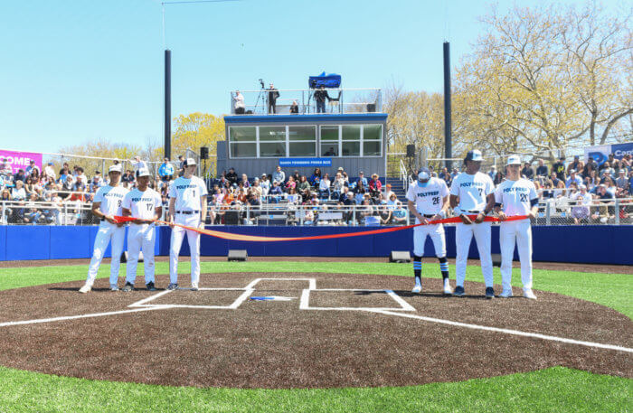 baseball players cut the ribbon on new baseball field at poly prep